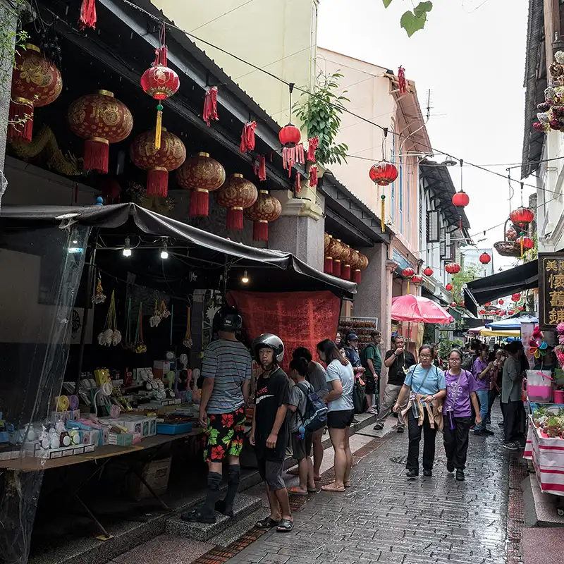 Visitors exploring Concubine Lane in Ipoh's old town, Perak, Malaysia
