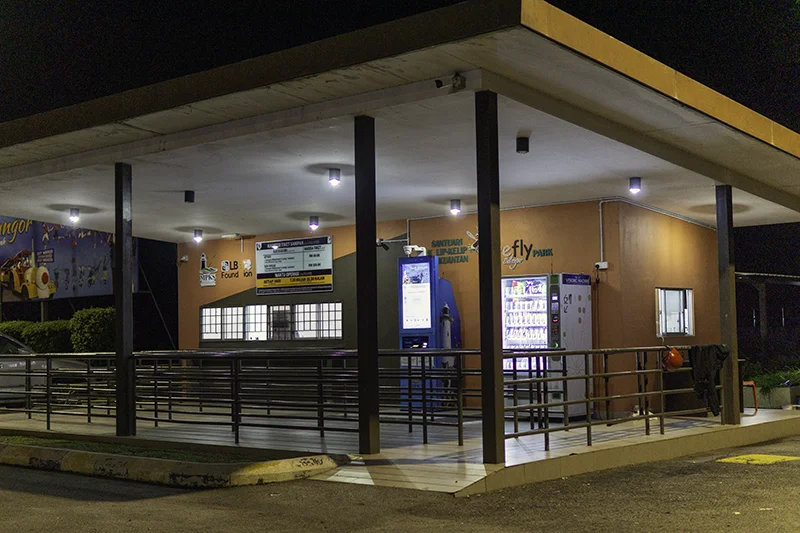 Kampung Kuantan Fireflies Park ticket counter and self-service ticket machine at night
