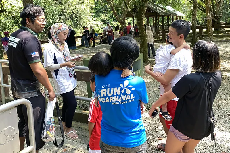 Tourists buying bathing with elephant tickets at Kuala Gandah Elephant Sanctuary