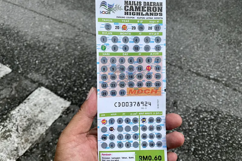 Parking ticket required by Cameron Highlands local authority for visitors driving on a Cameron Highlands day tour from Kuala Lumpur