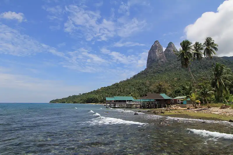Tioman Island coastline with twin peaks, one of the popular Malaysia destinations