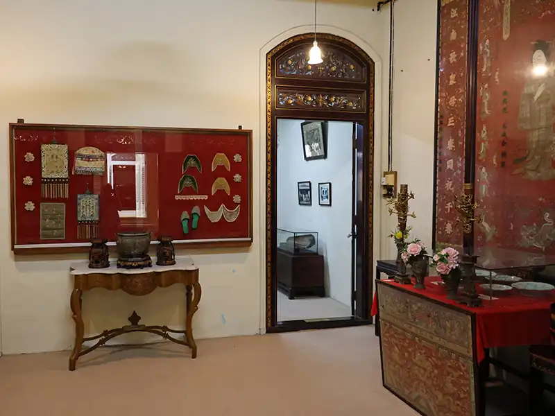 Interior of the Baba Nyonya Heritage Museum in Malacca showing traditional furnishings