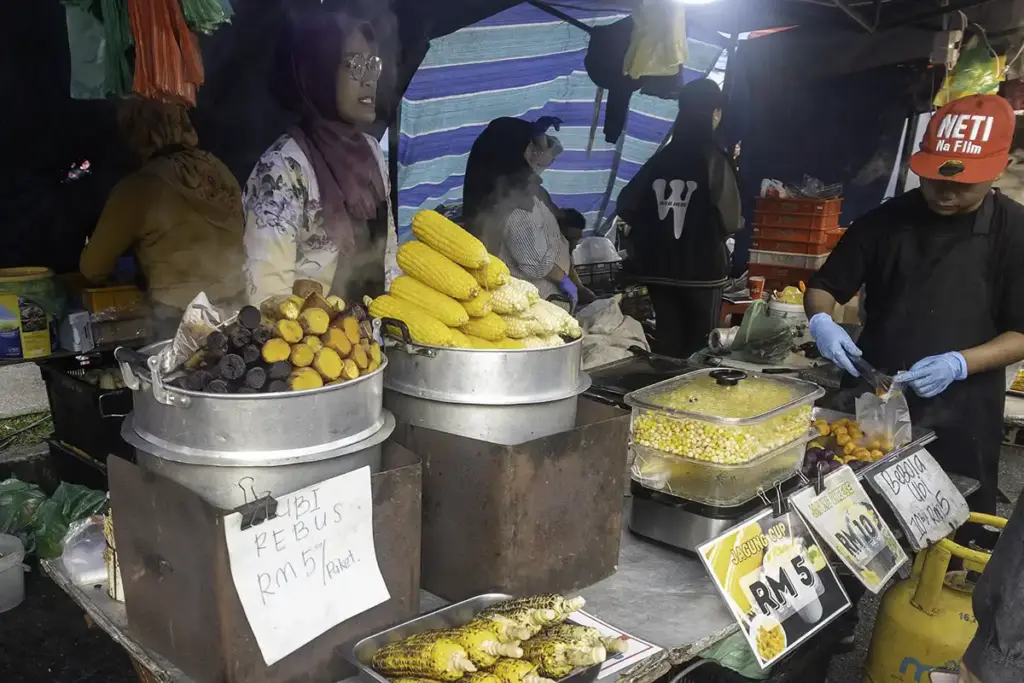 Night market in Cameron Highlands showing food stalls with clear price tags and English signage