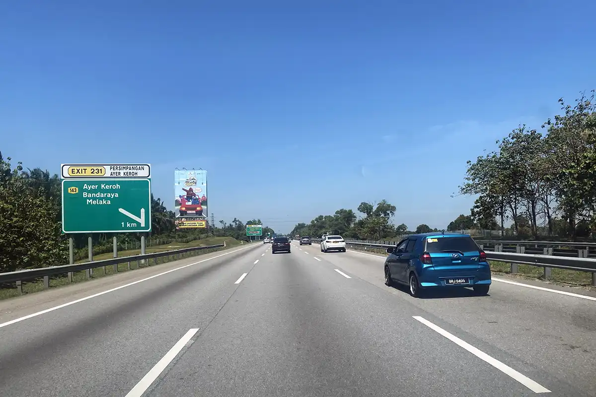 Malaysia travel guide showing modern highway travel toward Malacca